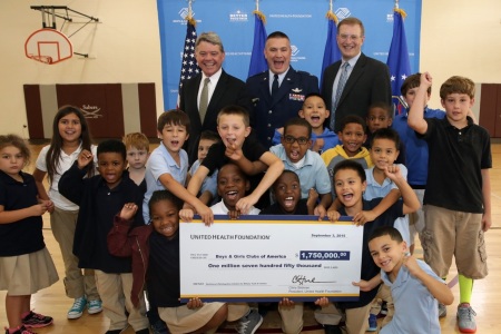 United health foundation awards the Boys & Girls Clubs of America with a $1.75 million grant at Peterson Air Force base in Colorado Springs Sept. 3, 2015. The grant will be used to create an interactive online platform and mobile application for military kids. Left to right: Kevin McCartney, BGCA Sr. Vice President for Government Relations, Col. Eric Dorminey, Vice Commander of 21st Space Wing, and Dr. John Williams, Sr., M.D., Senior Medical Director, UnitedHealthcare Military & Veterans.